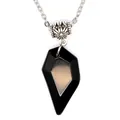 Close-up of a black faceted geometric pendant necklace with decorative silver bead. - Obsidian