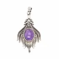 Detailed view of a vintage silver feather pendant with a purple oval amethyst stone - Amethyst