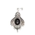Macro detail of a vintage silver-tone pendant with an oval black gemstone inlay - Obsidian