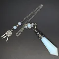 Detailed view of white opalite crystal prism pendulum with dreamcatcher and star charms - Opal
