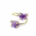 Detailed view of an adjustable gold ring featuring two raw purple amethyst stones. - Amethyst
