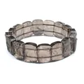 Detailed view of semi-transparent brown tektite stone bracelet with textured finish. - Raw Stone Style (Dark Black)