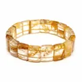 Macro detail of natural yellow gum flower crystal bracelet with rectangular beads - Yellow Hematoid Quartz