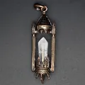 Detailed view of gothic vintage castle pendant with hexagonal crystal point center - White Crystal / Antique Red Copper