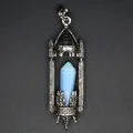 Macro view of a medieval vintage castle pendant with a blue hexagonal crystal pillar - Opal / Antique Silver