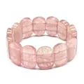 Close-up macro detail of polished oval pink strawberry quartz stones on a stretch bracelet. - Hand Plate Style / 11x18mm / Strawberry Quartz