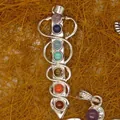 Detailed view of seven chakra natural gemstone healing pendant with silver wire wrap - Spiral Wrap Style (3)