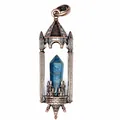 Detailed macro view of a vintage bronze castle pendant featuring a blue hexagonal crystal pillar - Apatite / Antique Red Copper