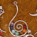 Detailed macro view of silver spiral pendant with colorful chakra gemstones - Spiral Snail Pendant Only (Without Chain) (16)