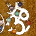 Close-up detail of a silver Om symbol pendant with seven colorful chakra crystal gemstones - Om Symbol Pendant Only (Without Chain) (20)