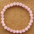 Natürliches 6 mm Rosenquarz-Perlenarmband mit durchscheinenden rosa Perlen - Kugelkette / Rosa