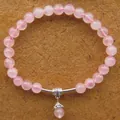 Handgefertigtes Armband aus rosa Rosenquarzperlen mit Silberanhänger im Ethno-Stil - Ethno Zubehör Stil / Rosa