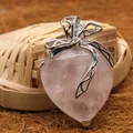 Elegant heart-shaped natural rose quartz crystal pendant with a stylish silver bow decoration - Rose Quartz Pendant
