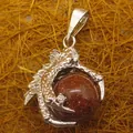 Silver-tone dragon claw pendant with a sparkling reddish-brown goldstone sphere. - Dragon Claw Grip (aljylp0065) / Goldstone Pendant
