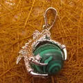 Silver dragon claw pendant holding a green malachite ball with gemstone accents. - Dragon Claw Grip (aljylp0065) / Malachite Pendant