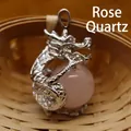 Elegant silver dragon pendant clutching a round pink rose quartz gemstone for jewelry - Rose Quartz Pendant Only (Without Chain)
