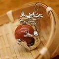 Dragon pendant clutching a sparkling goldstone sphere with silver-tone finish for jewelry - Goldstone Pendant Only (Without Chain)