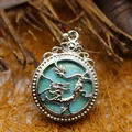 Pendaglio antico a forma di drago in argento con turchese in stile rustico. - Turchese