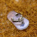 Elegant silver-toned flip-flop pendant with flower detail resting on an opalite base - Flip Flop Flower Pendant / Pendant Only / Opal