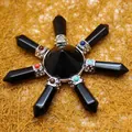 Black agate crystal pyramid array with seven chakra points on textured background - K9 / Black Agate
