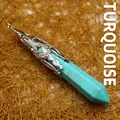 Hexagonal turquoise stone pendant featuring an intricate silver-tone filigree metal cap - Turquoise