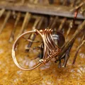 Handmade rose gold wire-wrapped ring featuring a round purple agate crystal bead - One Size / Smoky Quartz