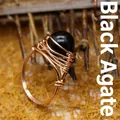 Anillo artesanal envuelto en alambre de oro rosa con una cuenta de ágata negra pulida - Talla única / Ágata negra