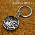 Llavero con colgante de flor de loto y obsidiana nevada natural - Obsidiana copo de nieve