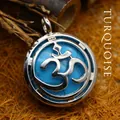 Vintage silver round pendant necklace featuring Om symbol and blue turquoise stone. - K9 / Blue Turquoise