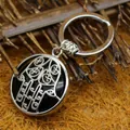 Ethnic style Hamsa hand keychain with black onyx inlay and silver metallic finish - Black Agate