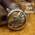 Antique style silver lotus pendant necklace featuring round Tiger Eye stone - Tiger's Eye