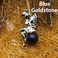 Elegant silver fairy pendant sitting on a sparkling blue sandstone crystal ball - Blue Sandstone