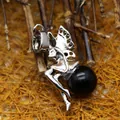 Elegant silver fairy wing pendant necklace featuring a polished round black agate stone bead - Black Agate