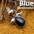 Eleganter silberner Engelsflügel-Anhänger mit dunkelblauem glitzerndem Sandstein-Tropfen - Blauer Sandstein