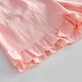 Detailed close-up showing the soft ruffle hem and cotton texture of pink home wear - S / Top And Bottom / Pink