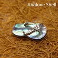 Handcrafted iridescent abalone shell flip-flop pendant with silver floral inlay - Abalone Shell