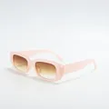 Macro detail of retro square sunglasses featuring pink frames and brown gradient lenses - Pink Frame Tea Lens