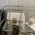Elegant white monogram printed small square bag featuring a stylish gold chain shoulder strap - White