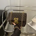 Vintage brown printed square bag featuring a gold chain strap and stylish M monogram pattern - Brown