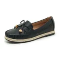 Detailed view of a black textured women's loafer with bow and wooden bead accents. - 41 / Black