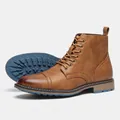 Detalle de botas Martin marrones para hombre con cuero texturizado y suela azul. - 7 / Marrón