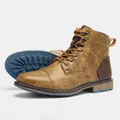 Detailed view of vintage men's work boots showing brown leather texture and blue sole - 7 / Vintage Distressed Brown Style (KD614)
