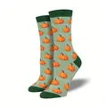 Detail of Halloween pumpkin pattern jacquard socks in light green color - One Size / Pumpkin