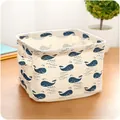 Fabric storage basket with blue whale pattern and side handles for desk organization - Whale