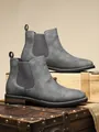 Detailed macro shot of grey men's Chelsea boots featuring elastic side panels. - 39 / Gray (11005)