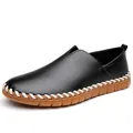 Men's black pebbled leather slip-on loafer with white woven edge and brown sole - 38 / Black