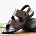 Side detail of brown men's leather sandals with adjustable backstrap and soft sole. - 38 / Brown