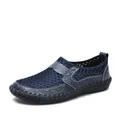 Detailed view of the breathable blue mesh upper and crocodile texture on men's loafers - Blue