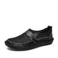 Close-up side view of men's black breathable mesh slip-on shoe with rubber sole - 38 / Black