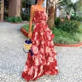 Stylish red floral two-piece resort set with ruffled camisole top and tiered maxi skirt. - Red / L